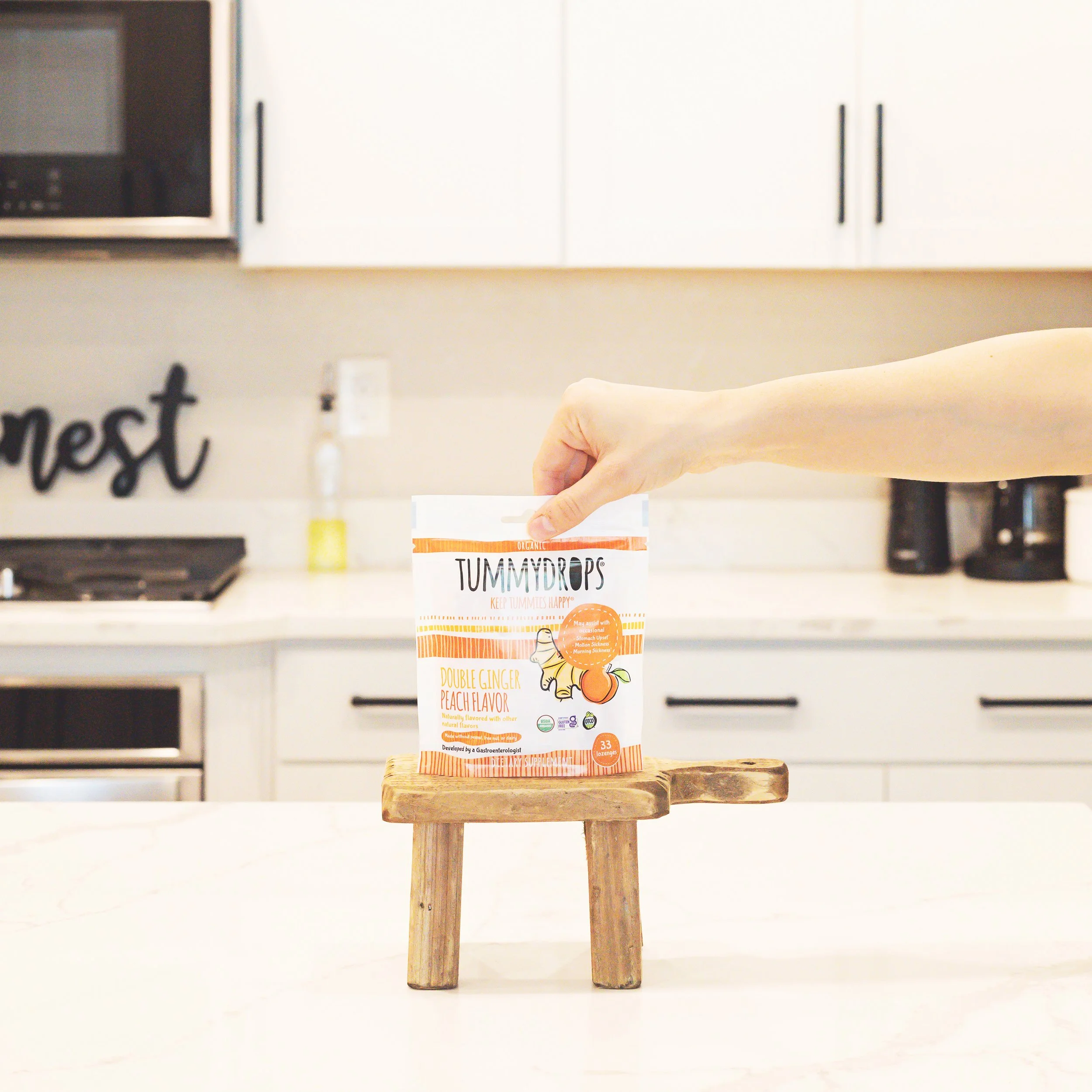 holding+the+peach.jpg?format=1000w